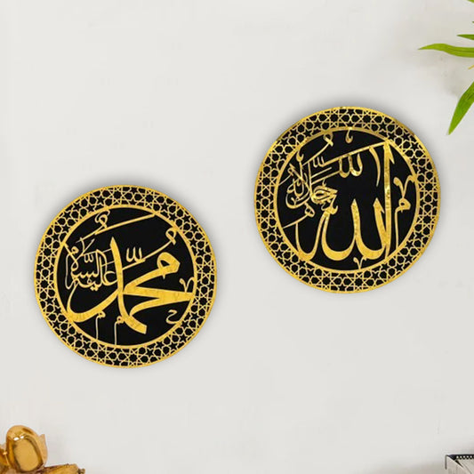 Two circular acrylic wall arts with black backgrounds and gold text, one larger than the other, hanging on a wall.