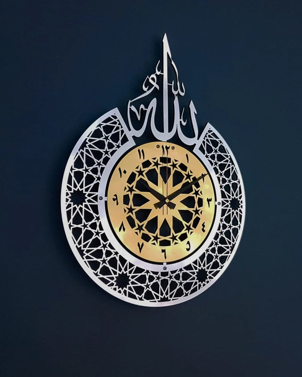 Enhance your living space with the a perfect fusion of faith and functionality. This elegantly designed wall clock features the revered name of Allah (SWT) in Arabic calligraphy, serving as both a timepiece and a spiritual centerpiece for your home.