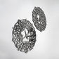 Decorative metal wall art pieces with intricate patterns on a white background