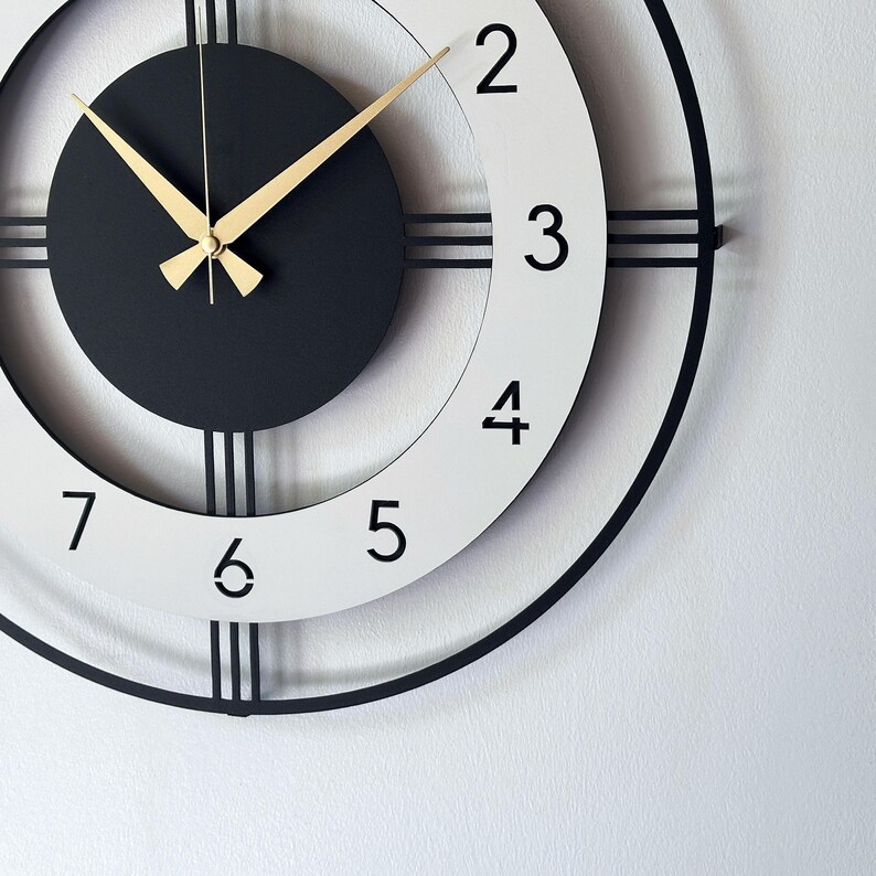 Craftholic Analog Mid Century Modern Big Size Metal Wall Clock

Elevate your interior décor with the Craftholic Analog Mid Century Modern Big Size Metal Wall Clock, a perfect blend of functionality and artistic design. This stylish timepiece serves as both a practical clock and a striking piece of wall art, enhancing the ambiance of any room.