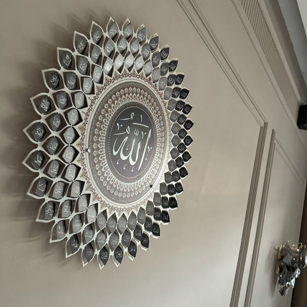 Decorative wall art with intricate design and central text on a plain wall.