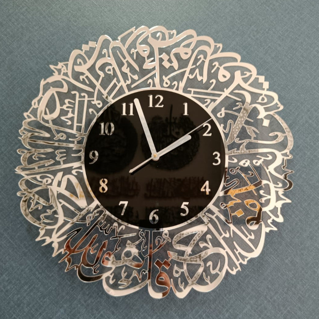 Decorative wall clock with intricate design on a gray background